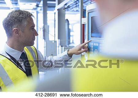 Workers at control panel in factory View Large Photo Image Stock Image - Workers at control panel in factory. Fotosearch