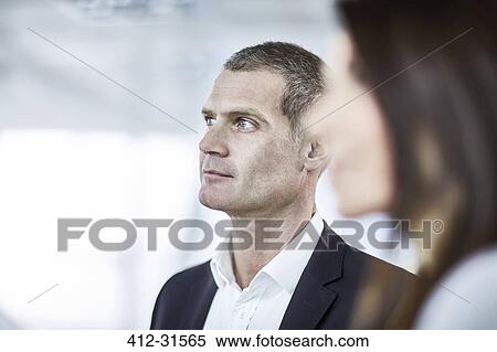 Attentive serious businessman listening in meeting View Large Photo Image Stock Photography - Attentive serious businessman listening in meeting. Fotosearch