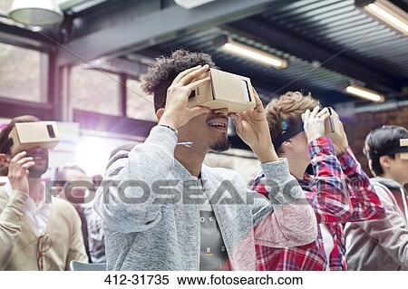 Audience trying virtual reality simulator glasses at technology conference View Large Photo Image Stock Photography - Audience trying virtual reality simulator glasses at technology conference. Fotosearch