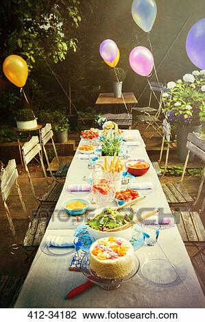 Balloons and food at garden party patio table View Large Photo Image Stock Image - Balloons and food at garden party patio table. Fotosearch