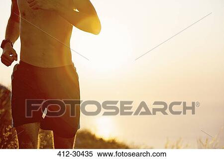 Bare chested man running at sunset View Large Photo Image Stock Photography - Bare chested man running at sunset. Fotosearch
