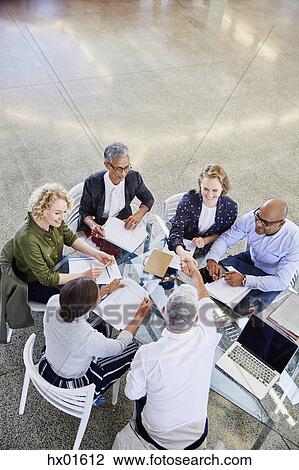 Business people handshaking in meeting View Large Photo Image Stock Image - Business people handshaking in meeting. Fotosearch