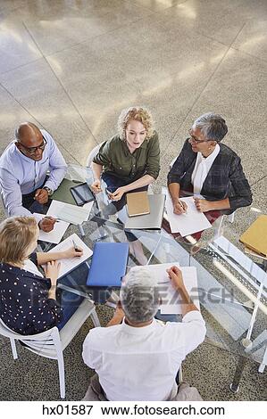 Stock Photo - Business people in meeting. Fotosearch