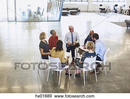 Business people meeting in circle View Large Photo Image Stock Photo - Business people meeting in circle. Fotosearch