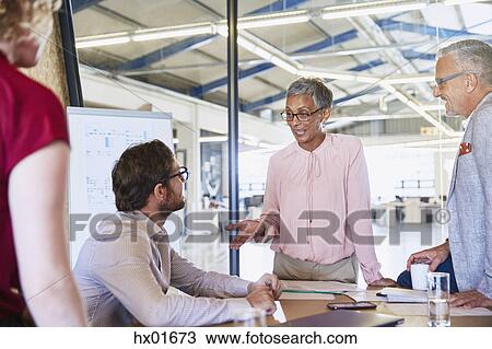 Business people talking in conference room meeting View Large Photo Image Stock Image - Business people talking in conference room meeting. Fotosearch