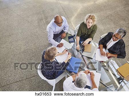 Business people talking in meeting View Large Photo Image Stock Image - Business people talking in meeting. Fotosearch