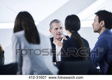 Business people talking in meeting View Large Photo Image Stock Photo - Business people talking in meeting. Fotosearch
