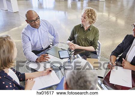 Business people talking in meeting View Large Photo Image Stock Photo - Business people talking in meeting. Fotosearch