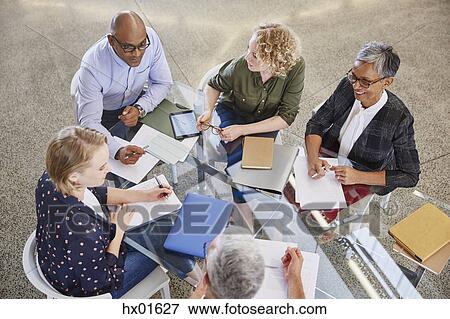 Stock Photo - Business people talking in meeting. Fotosearch