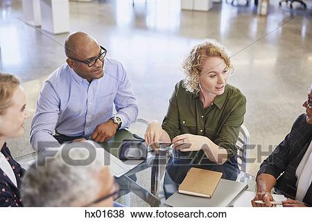 Business people talking in meeting View Large Photo Image Stock Photo - Business people talking in meeting. Fotosearch