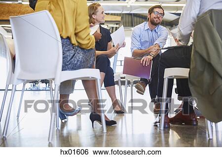 Business people talking in meeting circle View Large Photo Image Stock Photograph - Business people talking in meeting circle. Fotosearch