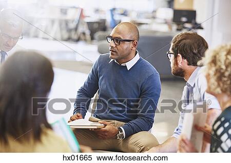 Stock Photography - Business people talking in meeting. Fotosearch