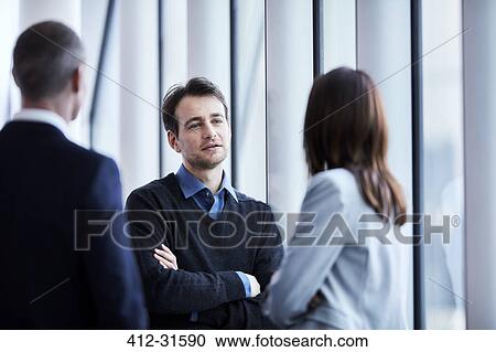 Stock Image - Business people talking. Fotosearch