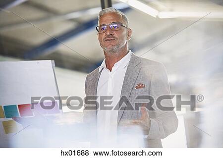 Businessman leading meeting View Large Photo Image Stock Photo - Businessman leading meeting. Fotosearch