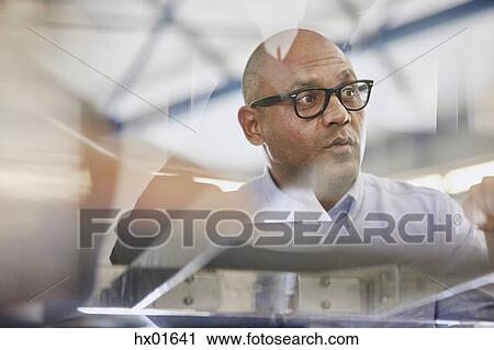 Businessman looking away View Large Photo Image Stock Image - Businessman looking away. Fotosearch
