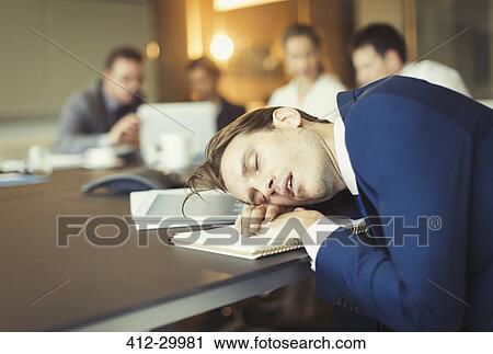 Businessman sleeping in conference room meeting View Large Photo Image Stock Image - Businessman sleeping in conference room meeting. Fotosearch