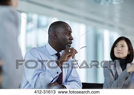 Businessman talking in meeting View Large Photo Image Stock Image - Businessman talking in meeting. Fotosearch
