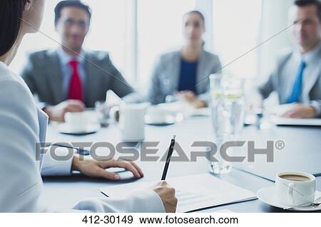 Businesswoman leading meeting in conference room View Large Photo Image Stock Photo - Businesswoman leading meeting in conference room. Fotosearch