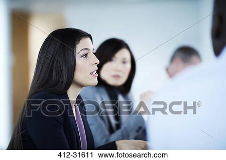 Businesswoman talking in meeting View Large Photo Image Stock Image - Businesswoman talking in meeting. Fotosearch