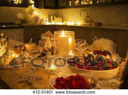 Stock Image - Candlelight Christmas table. Fotosearch