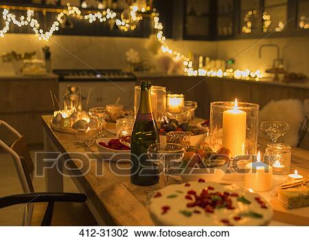 Champagne and desserts on candlelight Christmas table View Large Photo Image Stock Image - Champagne and desserts on candlelight Christmas table. Fotosearch