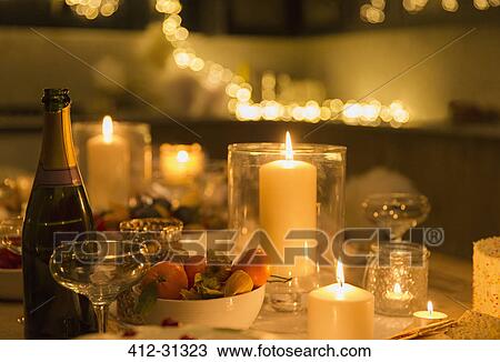 Stock Image - Champagne on candlelight table. Fotosearch