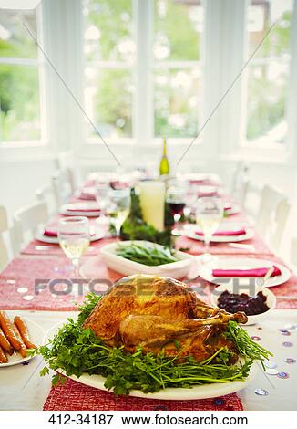 Christmas dinner turkey and white wine on dining table View Large Photo Image Stock Photo - Christmas dinner turkey and white wine on dining table. Fotosearch