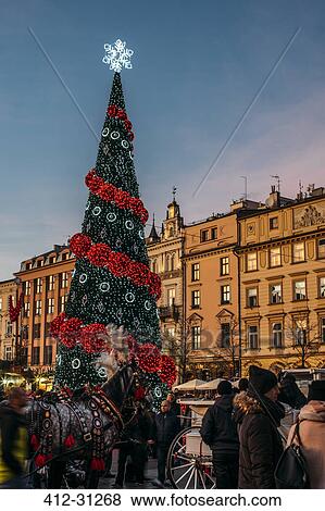 Christmas tree in town square, Cracow, Poland View Large Photo Image Stock Photo - Christmas tree in town square, Cracow, Poland. Fotosearch