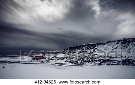 Church in remote snow covered landscape below stormy sky, Vik, Iceland View Large Photo Image Stock Photograph - Church in remote snow covered landscape below stormy sky, Vik, Iceland. Fotosearch