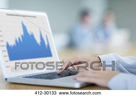 Close up of businesswoman using laptop in conference room View Large Photo Image Stock Image - Close up of businesswoman using laptop in conference room. Fotosearch