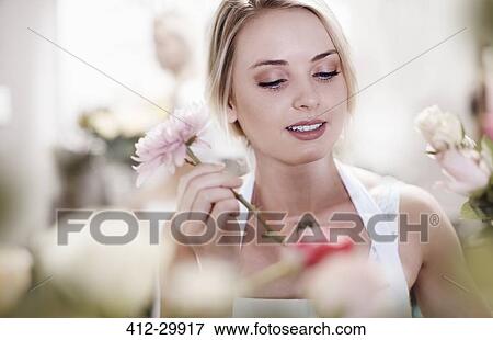 Close up of florist arranging bouquet View Large Photo Image Stock Photo - Close up of florist arranging bouquet. Fotosearch