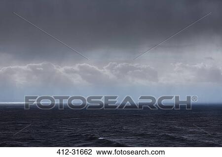 Clouds and rain over ocean seascape View Large Photo Image Stock Image - Clouds and rain over ocean seascape. Fotosearch