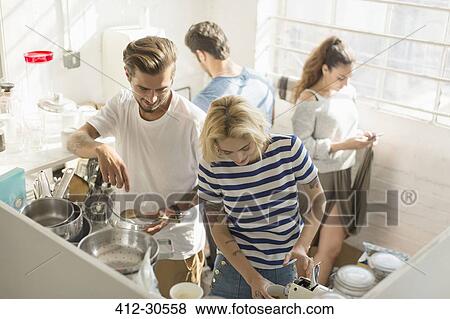 College student roommates sharing morning kitchen View Large Photo Image Stock Photo - College student roommates sharing morning kitchen. Fotosearch
