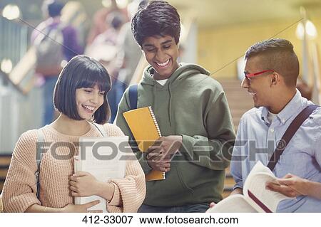 College students discussing homework in stairway View Large Photo Image Stock Photo - College students discussing homework in stairway. Fotosearch