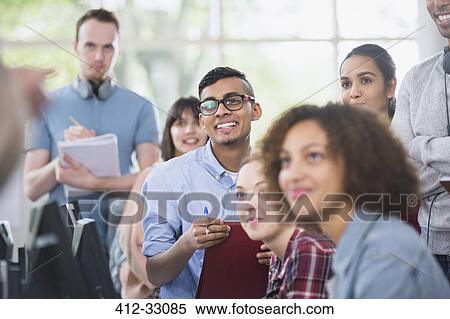 College students listening and taking notes in classroom View Large Photo Image Stock Photography - College students listening and taking notes in classroom. Fotosearch