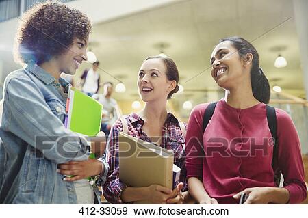 Stock Photo - College students smiling and talking. Fotosearch