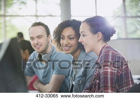 Stock Photography - College students studying at computer in computer lab. Fotosearch