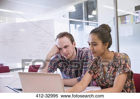 College students studying at laptop in classroom View Large Photo Image Stock Photography - College students studying at laptop in classroom. Fotosearch