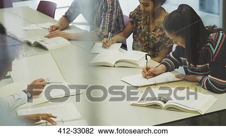 College students studying at table View Large Photo Image Stock Image - College students studying at table. Fotosearch