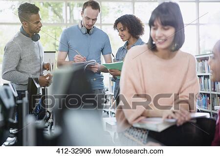 College students studying in library View Large Photo Image Stock Photograph - College students studying in library. Fotosearch