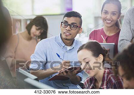 College students taking notes in classroom View Large Photo Image Stock Photograph - College students taking notes in classroom. Fotosearch
