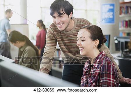 Stock Photo - College students using computer in computer lab classroom. Fotosearch