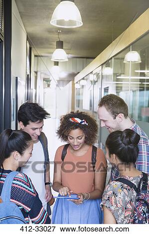 College students using digital tablet in corridor View Large Photo Image Stock Photo - College students using digital tablet in corridor. Fotosearch