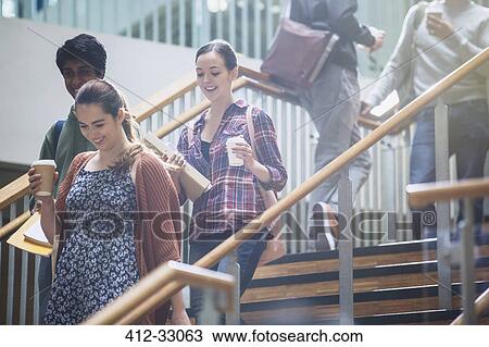College students with coffee descending stairway View Large Photo Image Stock Image - College students with coffee descending stairway. Fotosearch