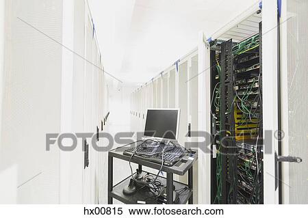 Stock Photography - Computer on cart in server room corridor. Fotosearch