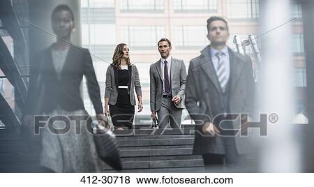 Corporate business people descending stairs View Large Photo Image Stock Photo - Corporate business people descending stairs. Fotosearch