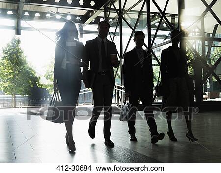 Picture - Corporate business people walking outside building. Fotosearch