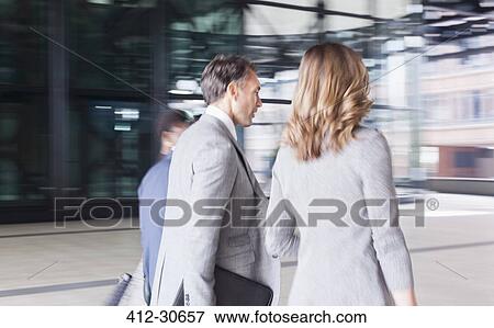 Corporate business people walking View Large Photo Image Stock Photo - Corporate business people walking. Fotosearch
