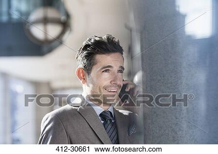 Corporate businessman talking on cell phone View Large Photo Image Stock Image - Corporate businessman talking on cell phone. Fotosearch