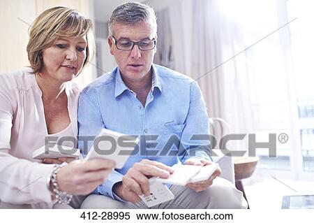 Couple browsing tile swatches View Large Photo Image Stock Photography - Couple browsing tile swatches. Fotosearch